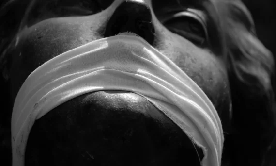 Statue with a gagged mouth.